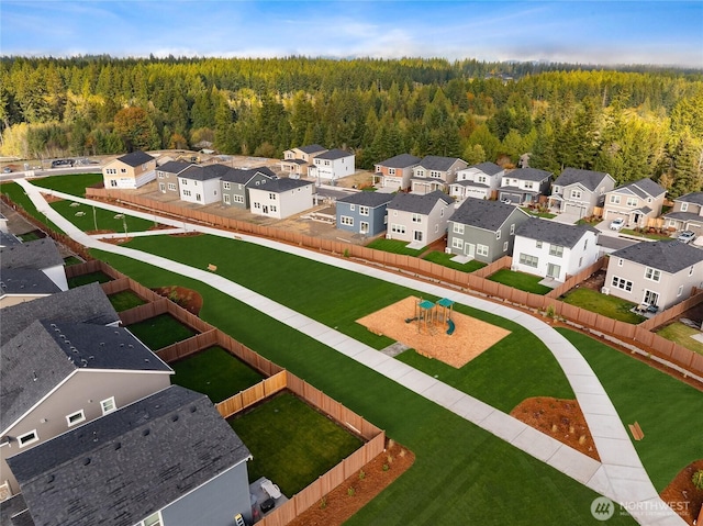 aerial view with a residential view and a wooded view