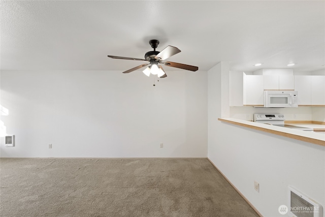 unfurnished living room with carpet floors, ceiling fan, visible vents, and recessed lighting