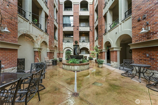 view of property's community featuring a patio area