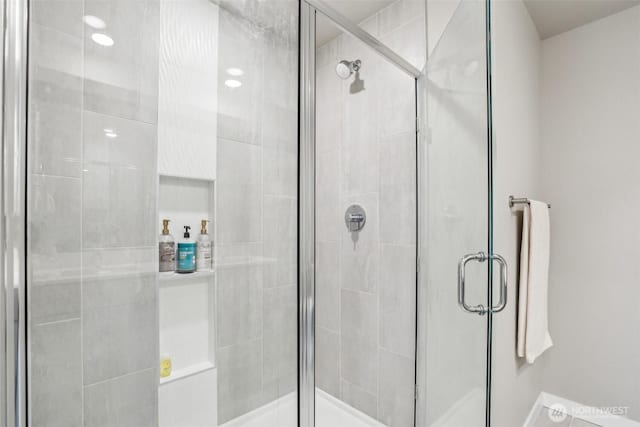 bathroom featuring a shower stall