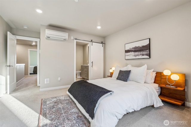 bedroom with a barn door, baseboards, a wall mounted air conditioner, carpet floors, and recessed lighting