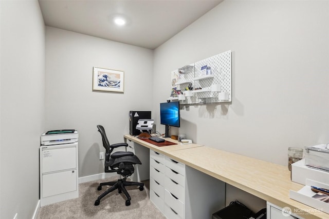 carpeted office with baseboards