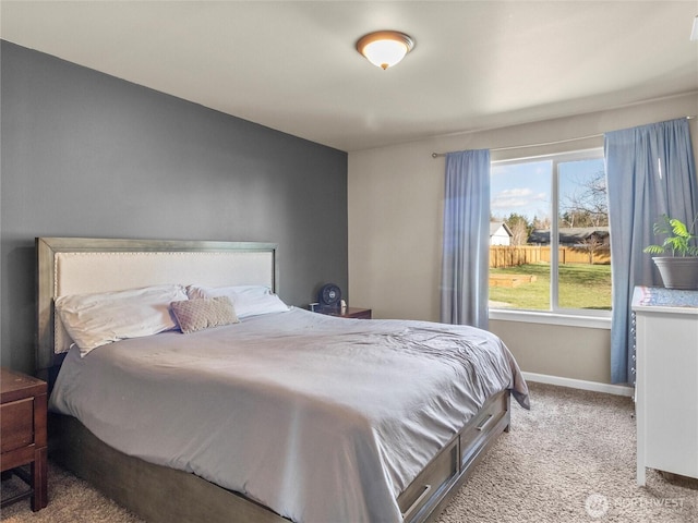 bedroom with carpet floors and baseboards