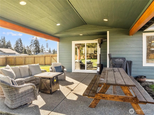 view of patio / terrace with outdoor dining space, fence, and an outdoor living space