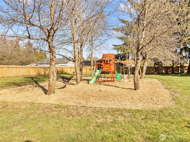 view of jungle gym featuring a fenced backyard and a yard