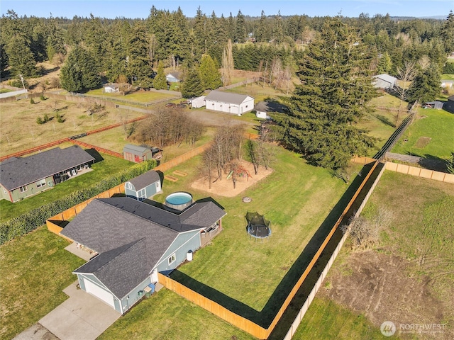 bird's eye view featuring a forest view