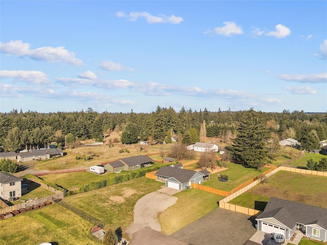 drone / aerial view with a residential view and a view of trees