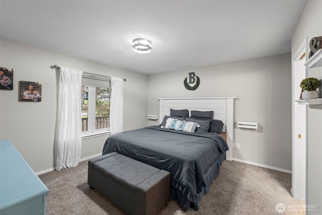 carpeted bedroom featuring baseboards