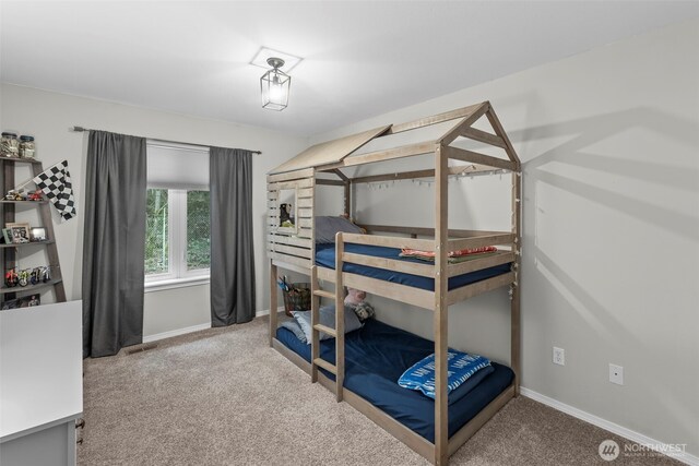 carpeted bedroom featuring visible vents and baseboards