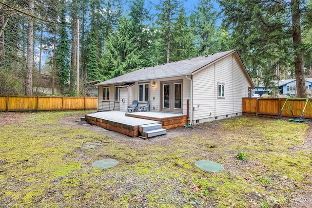 rear view of house featuring a deck, french doors, a fenced backyard, and crawl space