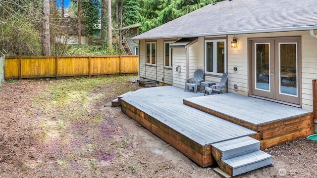 wooden terrace with french doors and fence