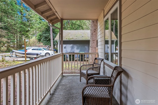 balcony featuring a porch