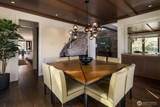 dining room with an inviting chandelier, plenty of natural light, dark wood-style flooring, and beam ceiling