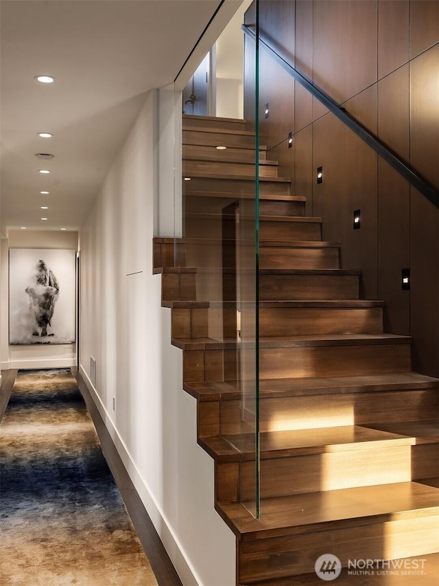 stairs featuring recessed lighting and baseboards