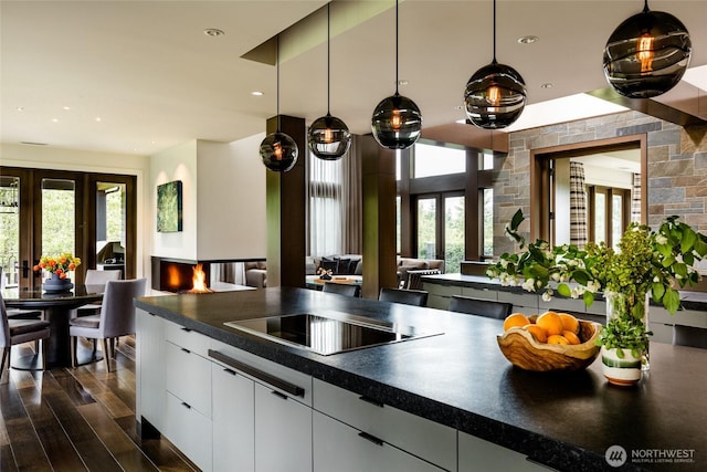 kitchen featuring dark countertops, french doors, and black electric cooktop