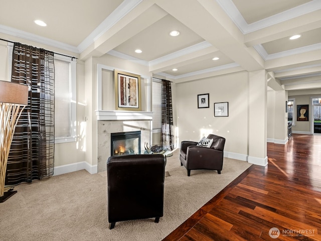 carpeted living area with crown molding, beam ceiling, a fireplace, and baseboards