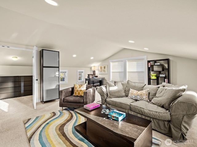 living area with light carpet, vaulted ceiling, and recessed lighting