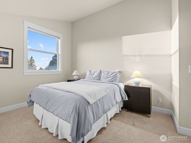 carpeted bedroom featuring baseboards