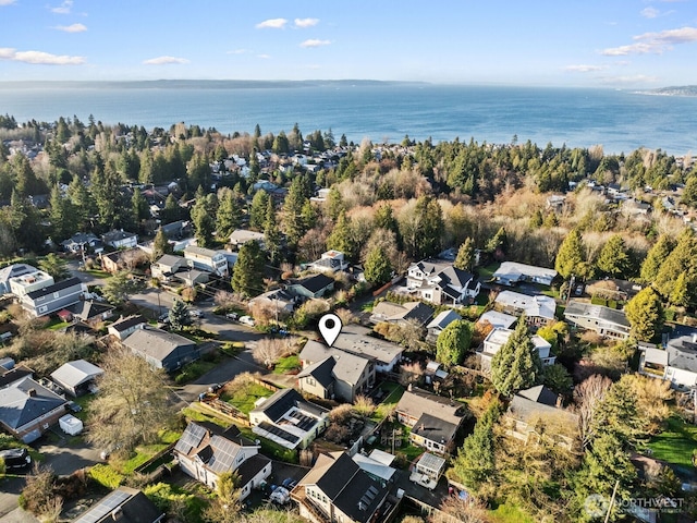 birds eye view of property with a water view and a residential view