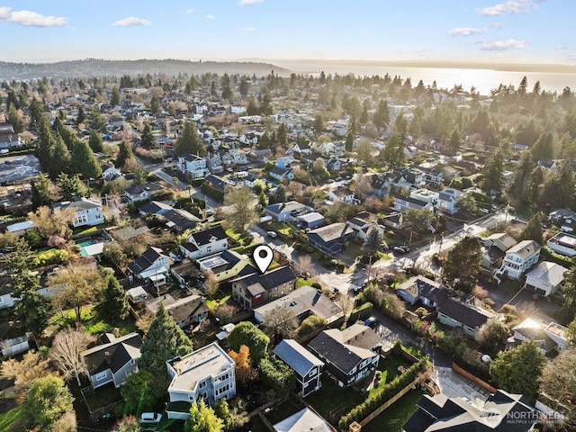 birds eye view of property featuring a water view and a residential view