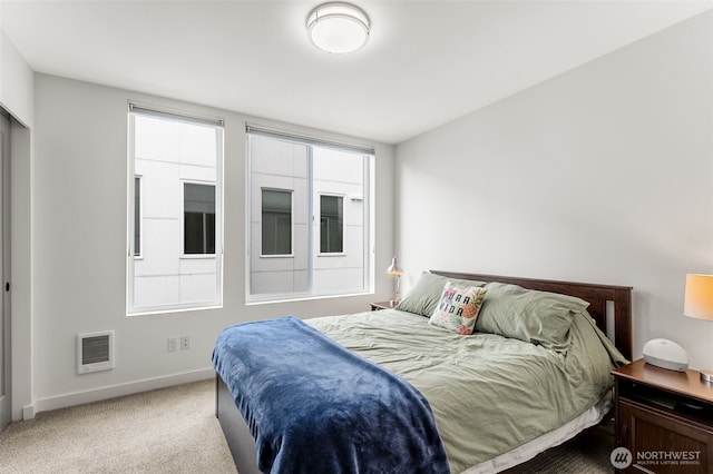 bedroom featuring carpet flooring and baseboards