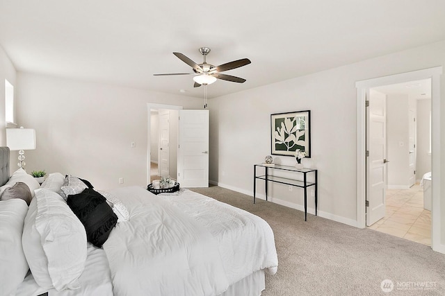 carpeted bedroom featuring baseboards and a ceiling fan