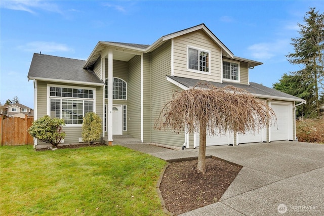 traditional-style home featuring a front yard, concrete driveway, and fence