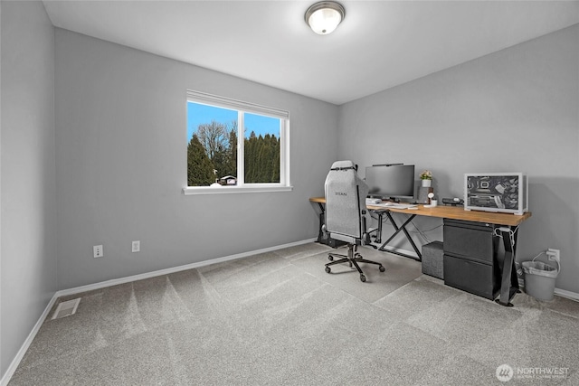 office featuring carpet floors, baseboards, and visible vents