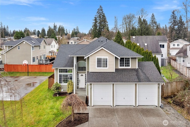 view of front facade featuring a shingled roof, fence, driveway, a residential view, and a front lawn