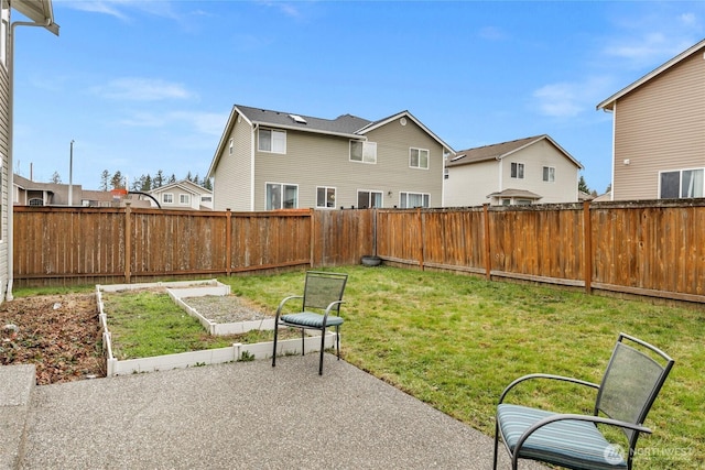 view of yard with a residential view, a garden, and fence