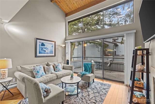 living area with a baseboard radiator, wood ceiling, high vaulted ceiling, and wood finished floors