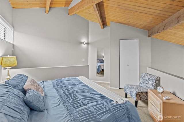 bedroom with lofted ceiling with beams, carpet floors, and wooden ceiling