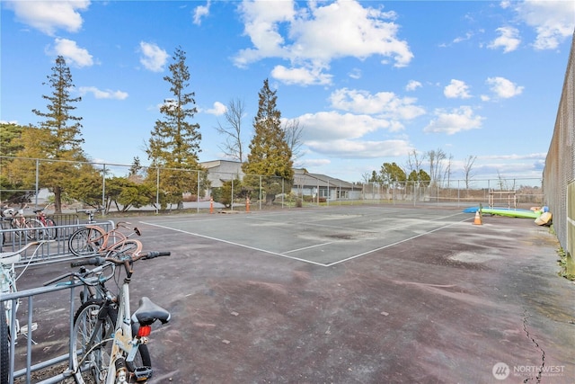 view of tennis court with fence