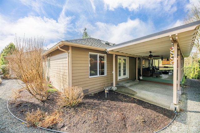 view of home's exterior with crawl space, a patio, a ceiling fan, and a shingled roof