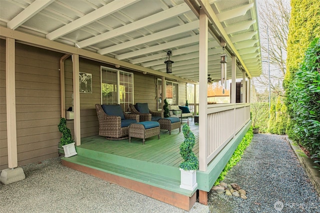 wooden deck with outdoor lounge area and covered porch