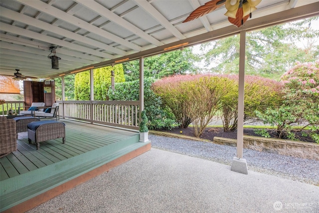 wooden terrace with a ceiling fan