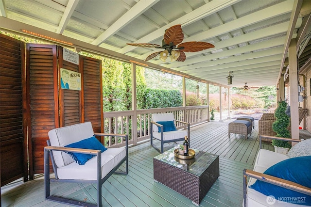 deck featuring a ceiling fan and an outdoor hangout area