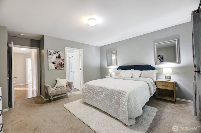 carpeted bedroom with baseboards