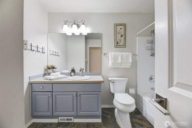 bathroom featuring visible vents, baseboards, toilet, vanity, and  shower combination