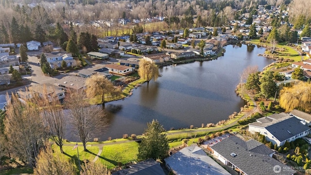 drone / aerial view with a water view and a residential view