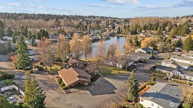 drone / aerial view featuring a water view and a residential view