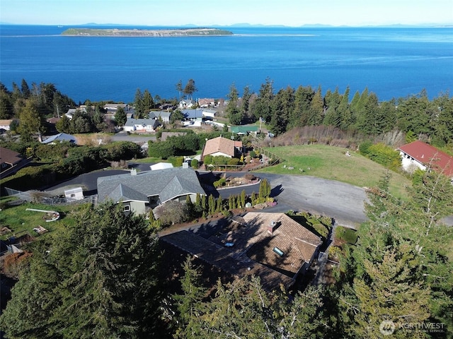 birds eye view of property with a water view