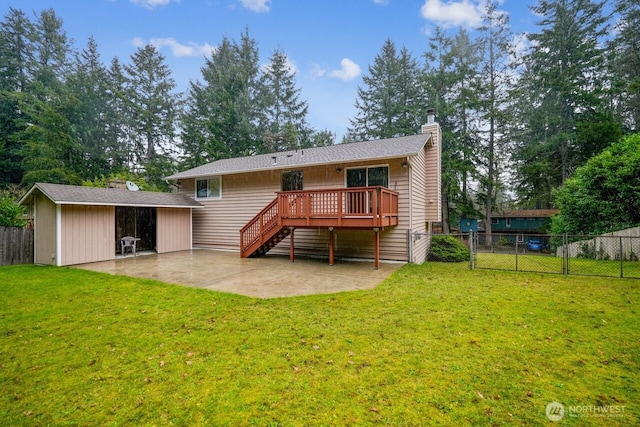 back of property featuring a patio, fence, stairway, a lawn, and a wooden deck