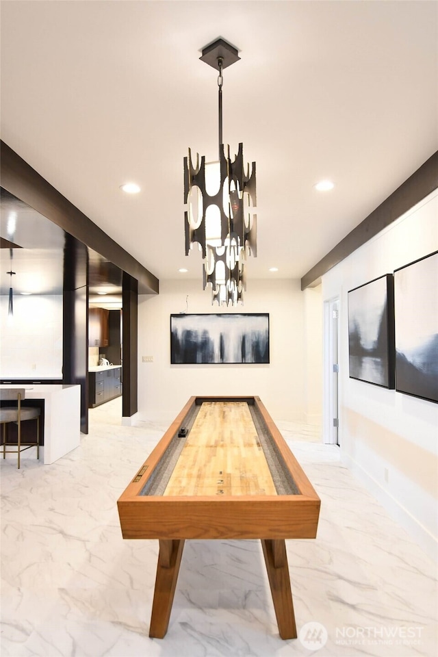 rec room featuring recessed lighting, marble finish floor, and baseboards