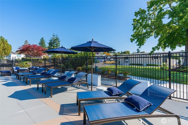 view of patio featuring fence