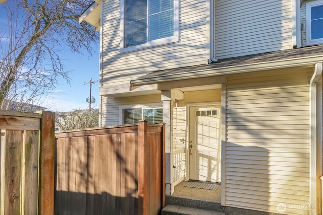 property entrance with fence