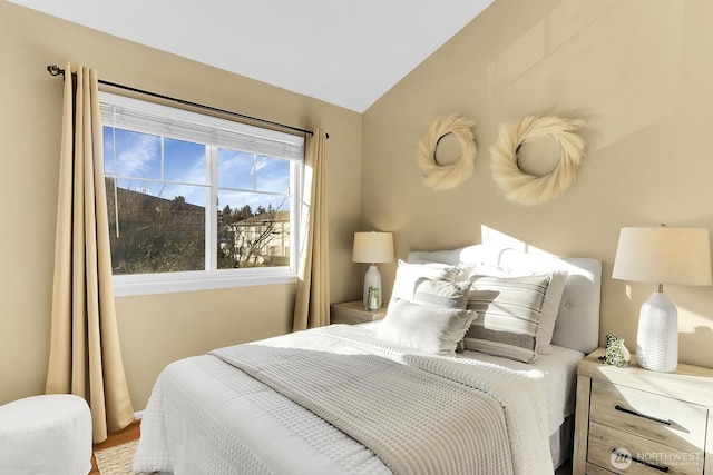 bedroom with lofted ceiling