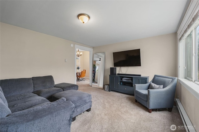 carpeted living area with a baseboard heating unit and an inviting chandelier