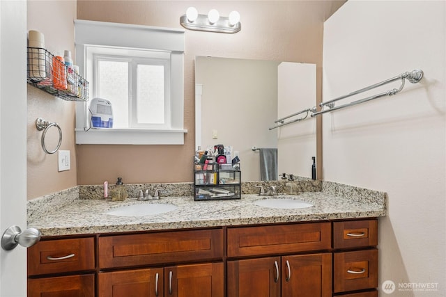 bathroom with double vanity and a sink