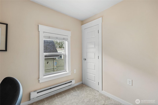 interior space with baseboards and a baseboard radiator